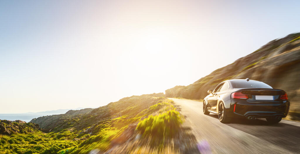 A car travelling along a mountain road