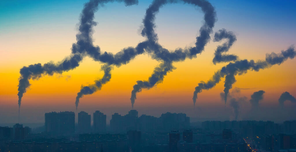 Factory chimneys spewing out smoke to spell CO2, symbolizing CO2 emissions from industry