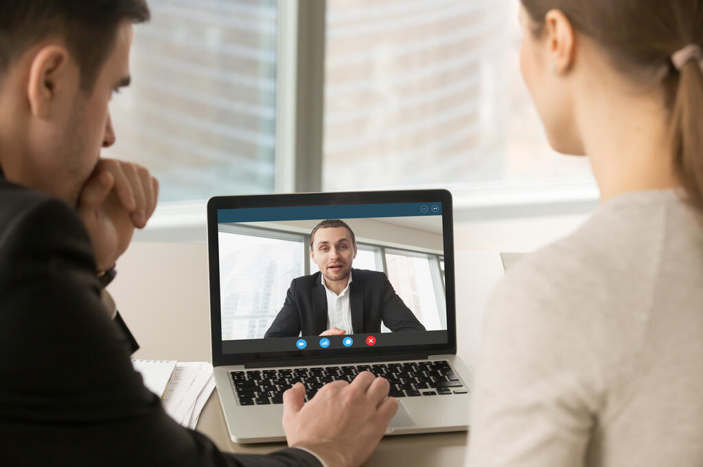 Three people having a virtual meeting