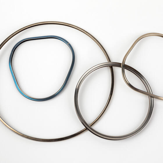 Four examples of metal E-seals