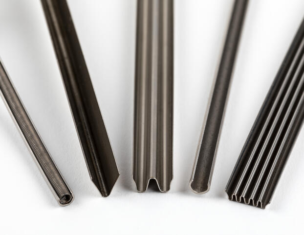 A cross section of five different metal seals.