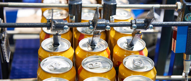 A beer can conveyor at a factory 