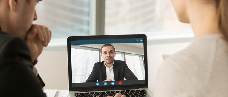 Three people having a virtual meeting